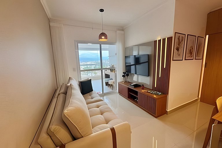 Apto varanda gourmet vista mar e serra. Ar cond.